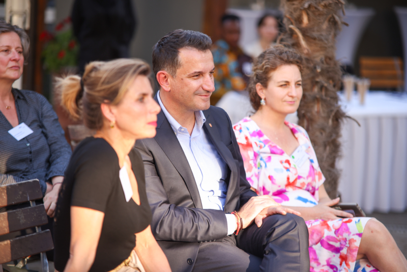A photo of participants seating in a garden at the Exploring "BORDERS": A preview of the NECE Festival 2024 in Tirana
