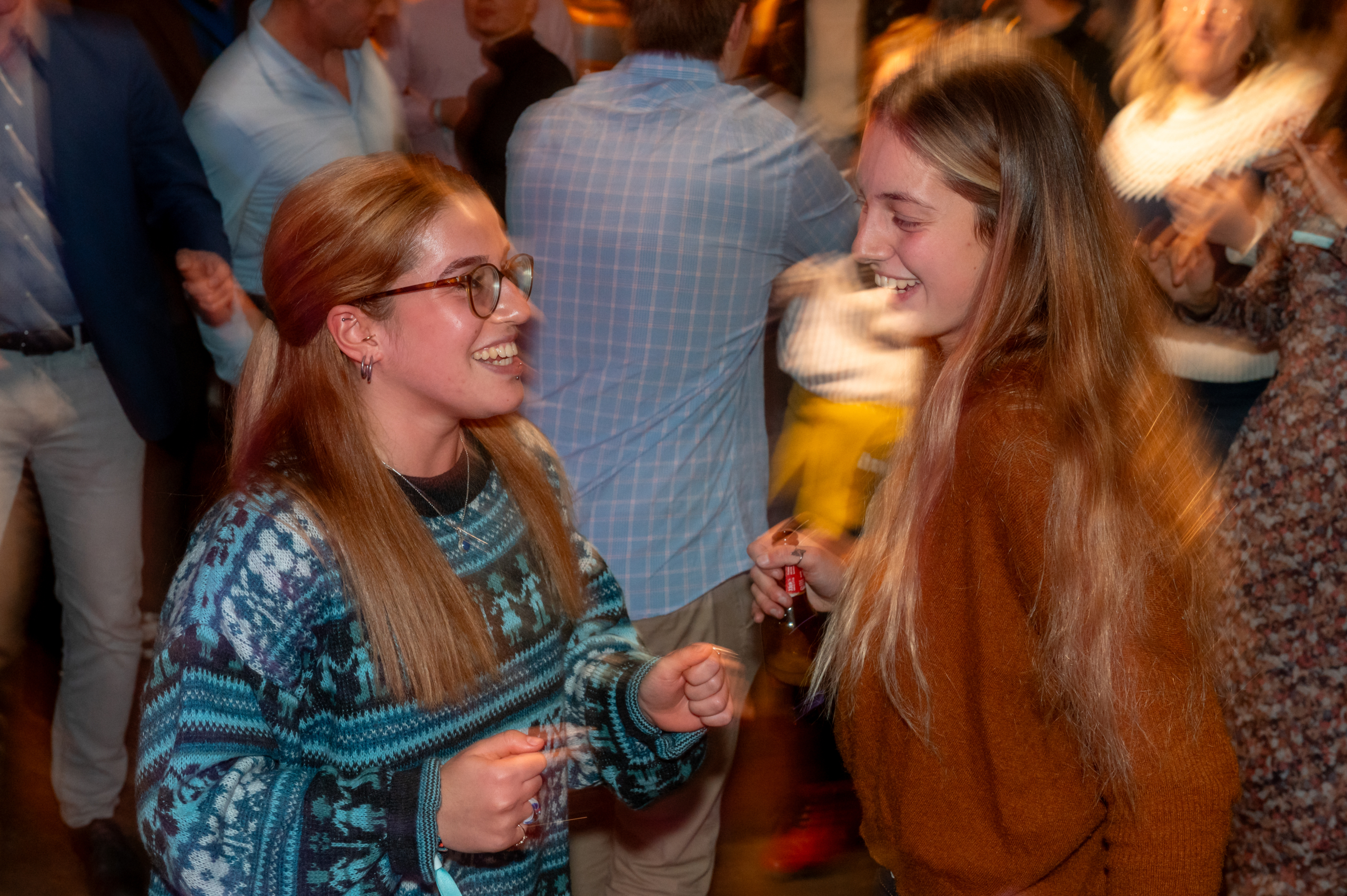 © THE CIVICS Innovation Hub | Geri Lula Two women laughing and dancing at a NECE Festival evening event.