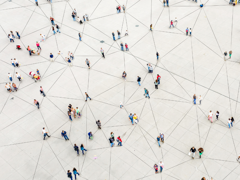 The image is showing people from above connected though lines, so it looks like a network.