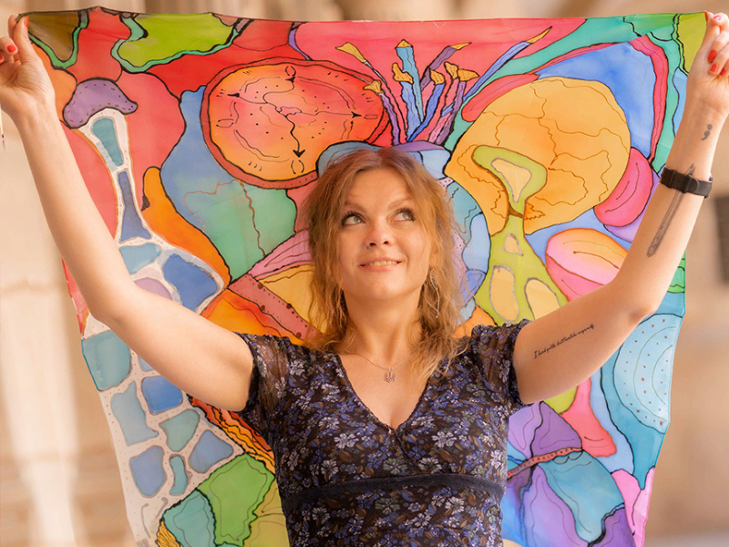 Picture of Ksenya Fuchs holding a painted fabrics